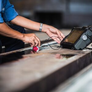 UT, Ultrasonic testing to detect imperfection or defect in welding of steel structure outside. NDT Inspection.