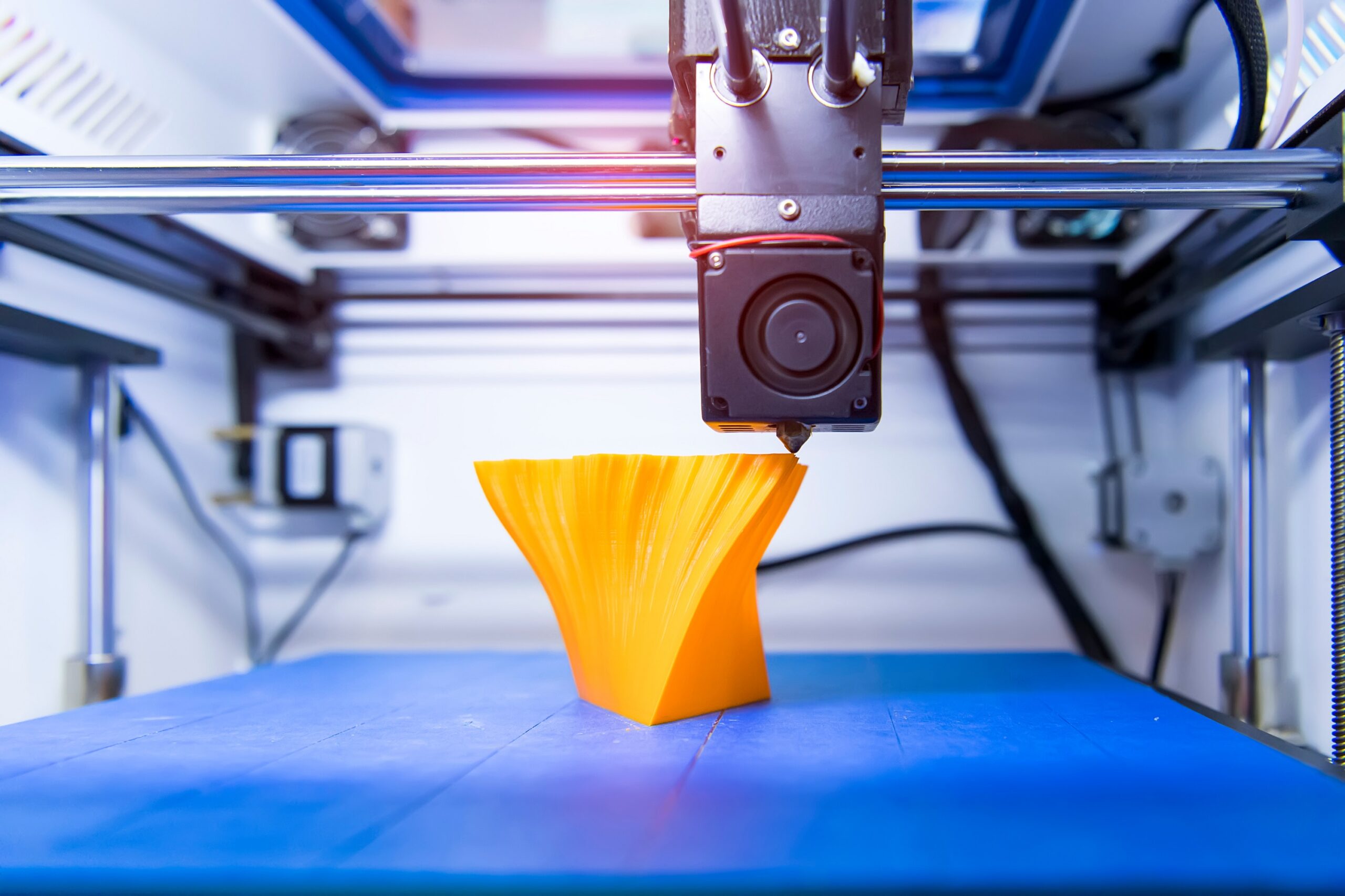 3D printer or additive manufacturing and robotic automation technology.