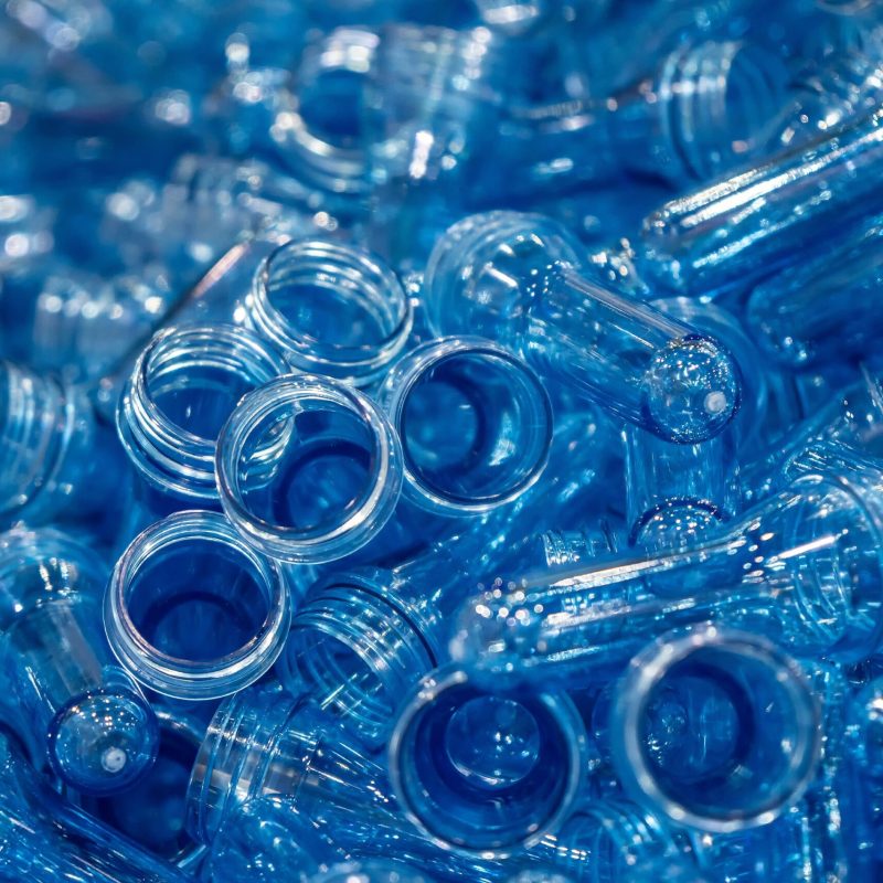 The pile of preform shape for plastic bottle blowing process. The raw material of PET bottle manufacturing process.